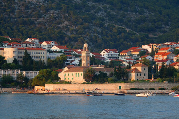 Small picturesque town Hvar on island Hvar, Croatia, illuminated by warm sunset light.
