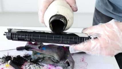 Master filling ink into printer cartridge 4k movie. Repair and maintenance of household appliances concept