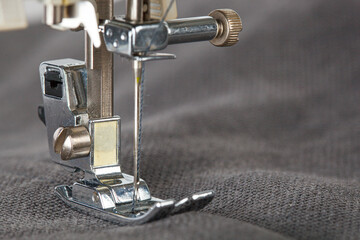 Sewing machine, stitching fabrics, needle in a round plan
