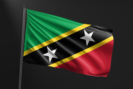3d illustration flag of Saint Kitts and Nevis. Saint Kitts and Nevis flag waving isolated on black background. flag frame with empty space for your text.
