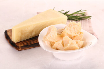 Chopped Italian hard parmesan cheese