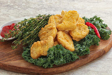 Crispy chicken nuggets with tomato ketchup