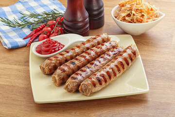 Grilled sausages with cabbage and sauce