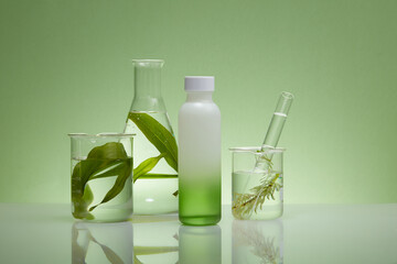 Front view of a bottle unbranded displayed on green background with flasks containing seaweed leaves. Mockup for design, organic cosmetics, beauty products concept with natural extract