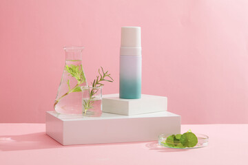Against the pink background, a blank bottle container cosmetic placed on white podiums with...