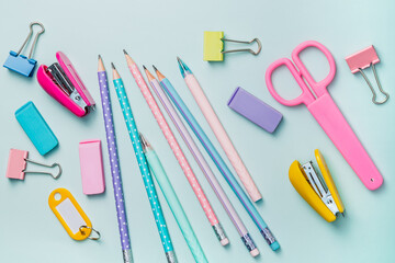 Stationery in pastel colors on a blue background. Back to school.