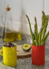 colorful recycled cans used as containers in the kitchen