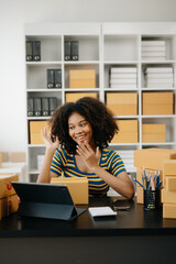 Small business entrepreneur SME freelance African woman working at home office, BOX,tablet and laptop online, marketing, packaging, delivery,  e-commerce concept