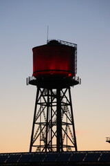 water tower at sunset