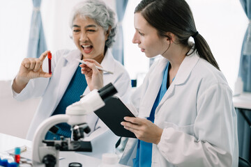 Scientist works with a pipette and a test tube. Scientific laboratory of biotechnology, development of medicine and research in chemistry, biochemistry and experiments.