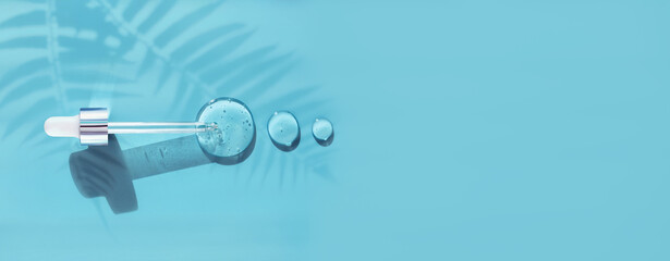 pipette drop of serum test on a blue background