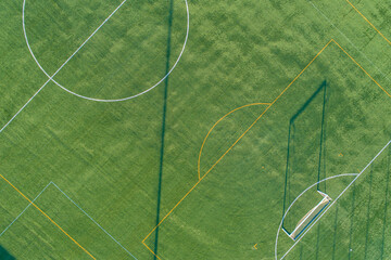 zenithal aerial view of a artificial grass football field