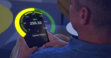 Animation of speedometer data processing over caucasian businessman using tablet - Powered by Adobe