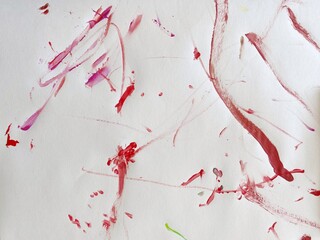 abstract chaotic red strokes of paint on a light background