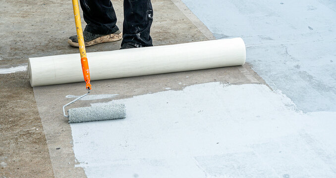 Hand painted gray flooring with paint rollers for waterproof, reinforcing net,Repairing waterproofing deck flooring.	         