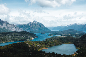 Lakes against snowcapped mountains