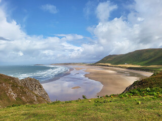Rhossili Bay lies at the western end of the beautiful Gower peninsula. 3 miles of golden sands, iconic landscapes including Rhossili Downs and Llangennith Beach.