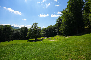 Sarmizegetusa Regia historical landmark in Romania. Wide angle photo during a sunny day in the middle of green forest Orastiei Mountains. Landmarks of Romania.