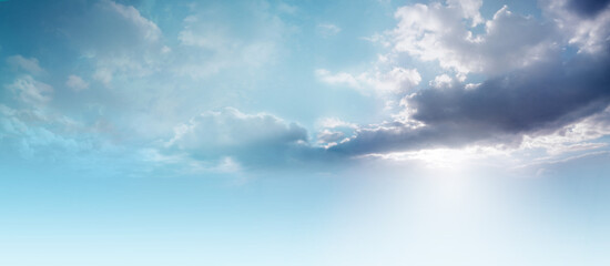 Beautiful Romantic dreamy pale blue evening cloudscape  background banner - big plume of dark blue...