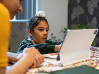 Fototapeta Mother homeschooling son (6-7) using digital tablet obraz