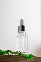 Amber glass bottles with dropper pipette with serum or essential oil on white background.