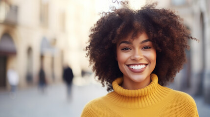 Happy young african american woman smiling in the city street , closeup Portrait of a happy young adult African girl standing on a European city outdoor - Powered by Adobe