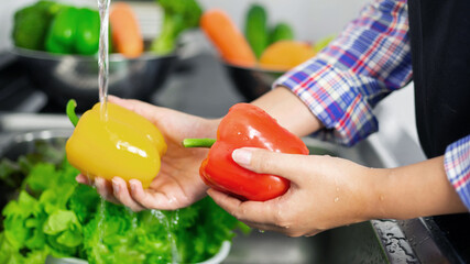 Washing vegetables in the kitchen sink