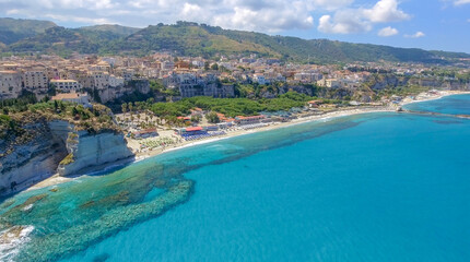 Fototapeta na wymiar Panoramic aerial view of Tropea coastline and beaches in summer, Calabria - Italy