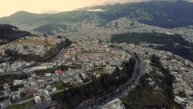 drone aerial shot in 4k, downward movement showing the south of Quito city, monjas sector, province of Pichincha, Ecuador.