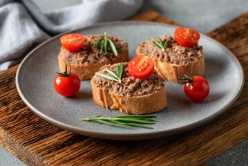 Toast with liver pate. Open sandwich with liver pate. Side view, selective focus.