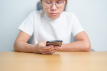 Casual woman holding and using smartphone for sms messages, young woman typing touchscreen mobile phone. lifestyle, technology, Social media and network concept