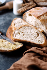 Close-up of a porous piece of bread on the table. Healthy breakfast. Organic food