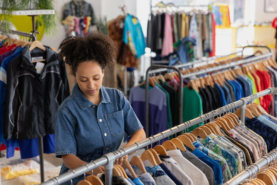 Young adult female shopping in a thrift store