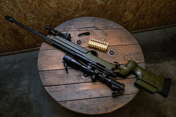 Fototapeta premium Cool American sniper rifle and ammo, close-up photo.