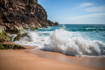 Calm ocean in Nazare, beach side in summertime, Portugal