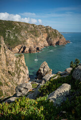 Fototapeta na wymiar The stunning top landscape view of cliffs in Cabo da Roca to Azenhas do Mar in Sintra, portugal