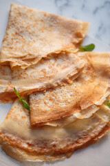 fried airy thin French pancakes.