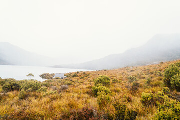 Exploring Dove Lake and Boatshed in Tasmania on misty day