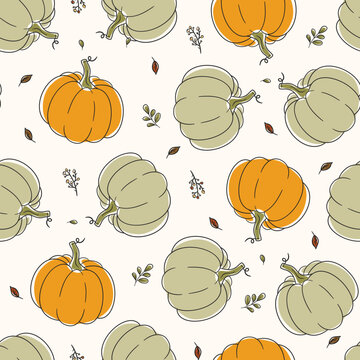 Seamless pattern with colorful pumpkins and plant sprigs