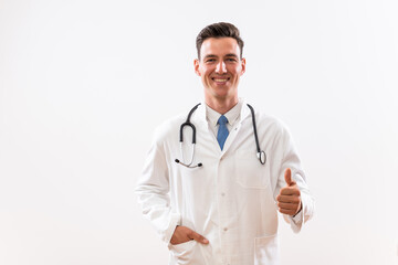 Fototapeta premium Portrait of young content doctor showing thumb up. 