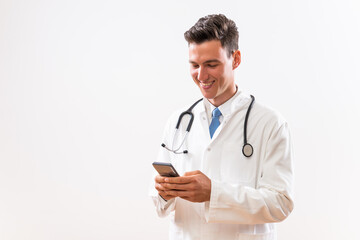 Fototapeta premium Image of young doctor using phone. 