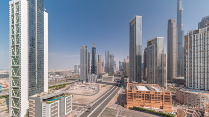 Aerial view of Dubai Downtown skyline with many towers all day timelapse.