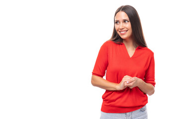 portrait of a charming cute young european brunette lady in a red t-shirt on a white background with copy space