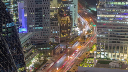 Fototapeta na wymiar Aerial view of traffic on Al Saada street in financial district night timelapse in Dubai, UAE.