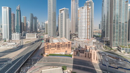 Aerial view of Dubai Downtown skyline with many towers timelapse.