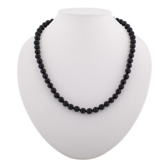 Dark mineral necklace on a white mannequin