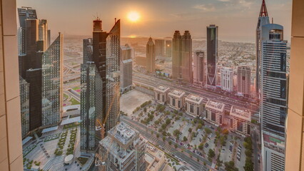 High-rise buildings on Sheikh Zayed Road in Dubai aerial timelapse during sunset, UAE.