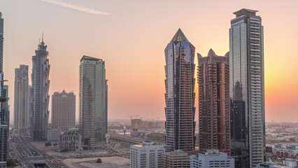 Obraz na płótnie Canvas Business bay district skyline with modern architecture day to night timelapse from above.