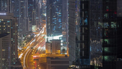 Fototapeta na wymiar Aerial view from above to a busy road junction in Dubai all night timelapse.