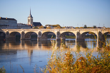 Obraz premium Scenic view of the Loire river with Cessart bridge in Saumur, Maine-et-Loire department, France